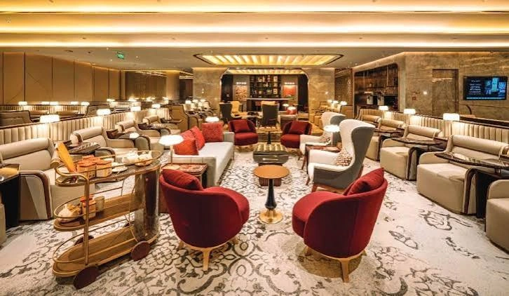 Elegant airport lounge with seating and refreshment service