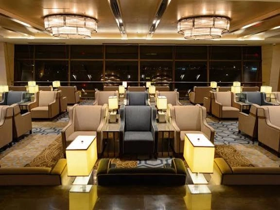 Premium airport lounge with individual seating and soft lighting